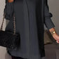 Elegante oversized overhemdblouse met opgerolde mouwen