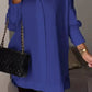 Elegante oversized overhemdblouse met opgerolde mouwen