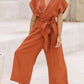Stijlvolle Vintage V-hals Jumpsuit met Cross-Tie