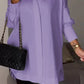 Elegante oversized overhemdblouse met opgerolde mouwen