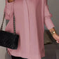 Elegante oversized overhemdblouse met opgerolde mouwen