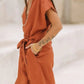 Stijlvolle Vintage V-hals Jumpsuit met Cross-Tie