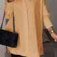 Elegante oversized overhemdblouse met opgerolde mouwen